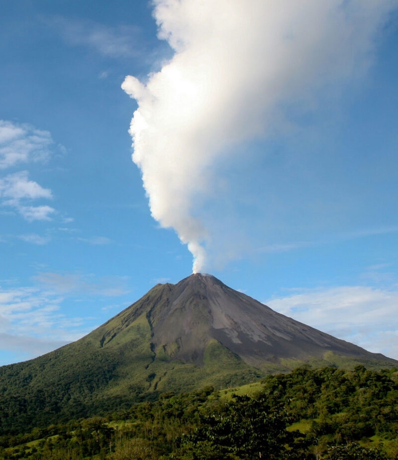 Arenal Volcano in Costa Rica with a plume of smoke.