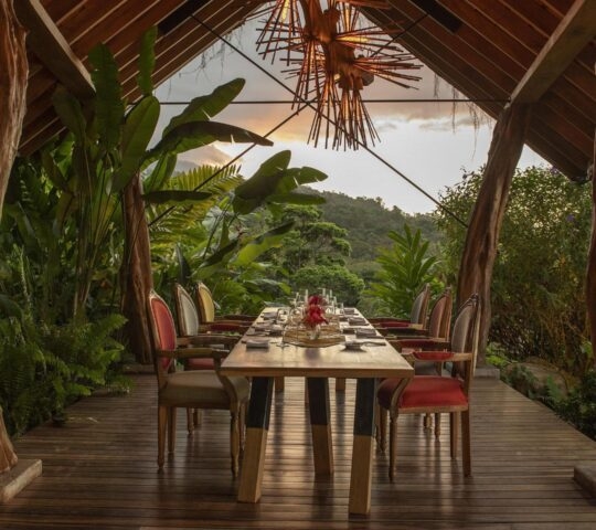 Outdoor dining area at Origins Lodge, Costa Rica
