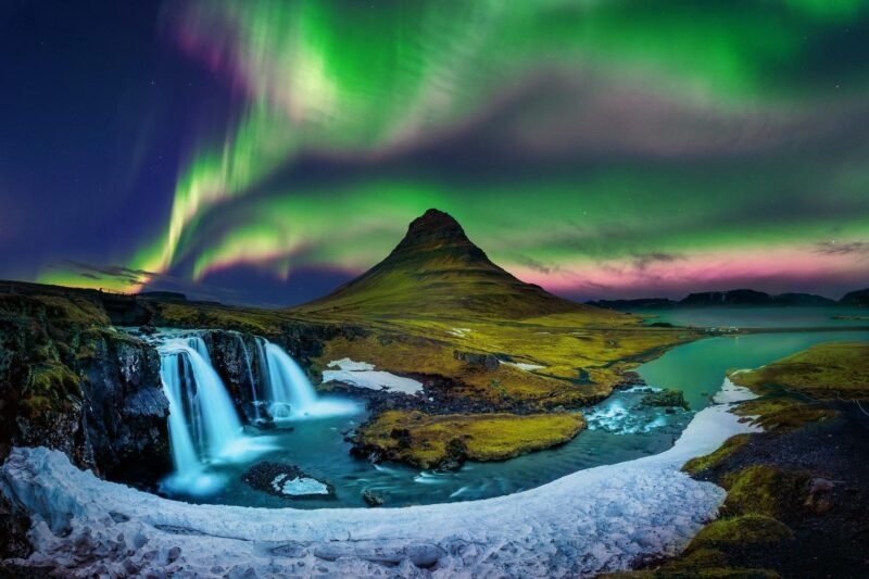 Northern lights tours - Northern Lights over a mountain in Iceland