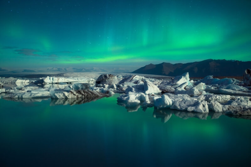 The Northern Lights over a lagoon in Iceland