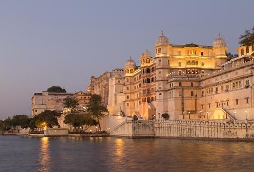 Sunset over Santorini cliffs, Udaipur City Palace in Rajasthan and Hohensalzburg Fortress in Salzburg.