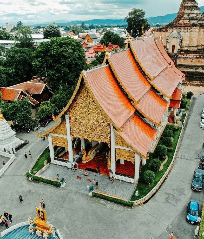 The beautiful architecture of Chiang Mai in Thailand and the renowned cliffside monastery of Paro Taktsang in Bhutan.