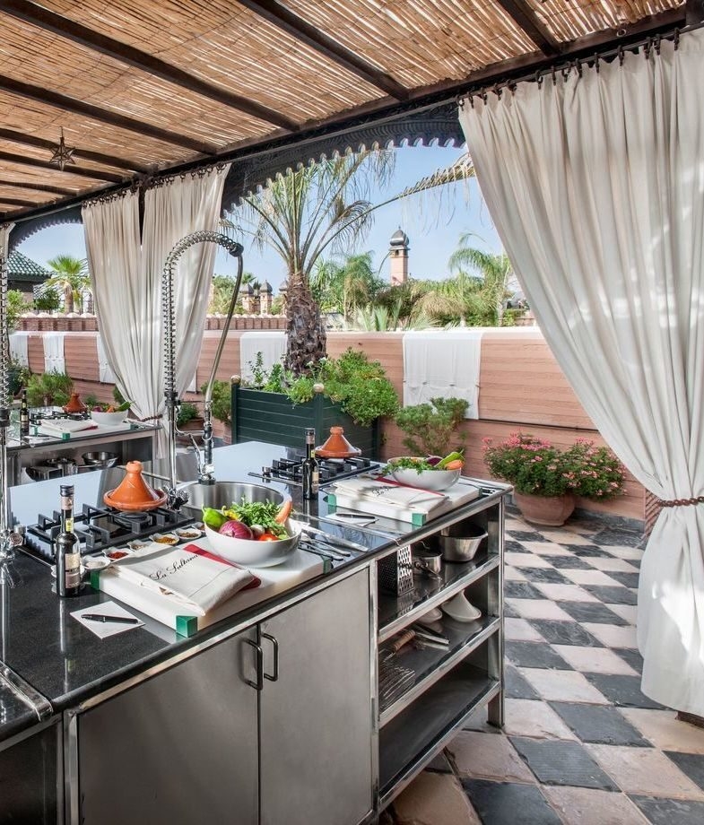 Chef harvesting fresh produce in the organic garden at Six Senses Zighy Bay, Oman, and a hands-on cooking class set up with local ingredients at La Sultana Marrakech.