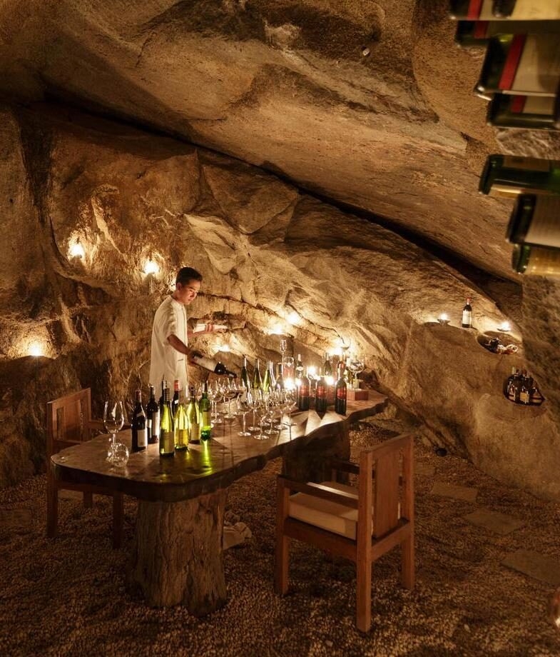 Open-air dining with ocean views at Trisara in Phuket and wine tasting in the candlelit rock cellar at Six Senses Ninh Van Bay in Vietnam.