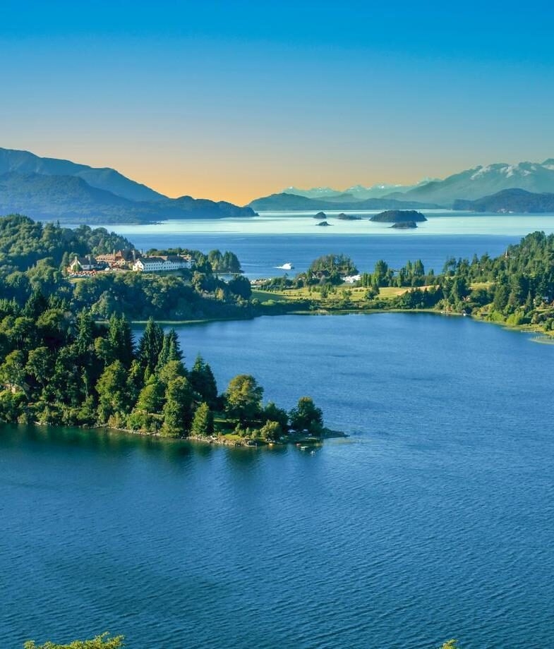 Blue lakes and forested hills in Argentina’s Lake District and colourful rows of tulip fields in bloom during spring in New Zealand.
