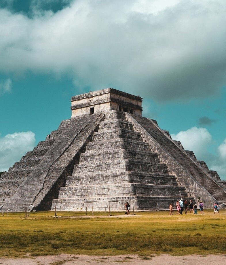The pyramidal Temple of Kukulkan at Chichén Itzá and the seaside ruins of Tulum, which sit above Playa Ruinas.