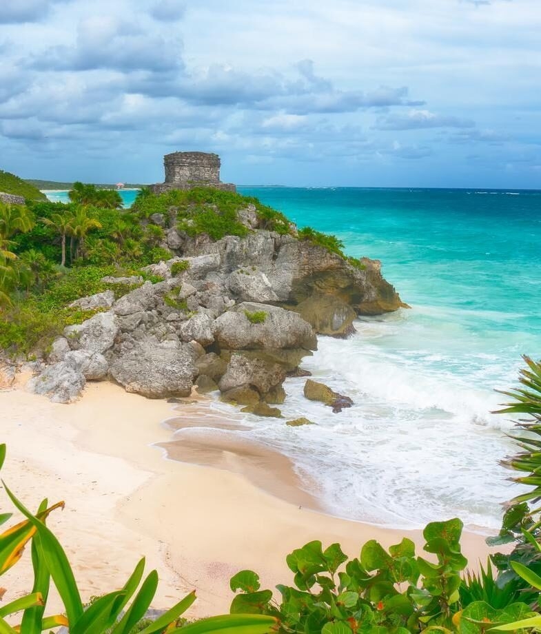The pyramidal Temple of Kukulkan at Chichén Itzá and the seaside ruins of Tulum, which sit above Playa Ruinas.
