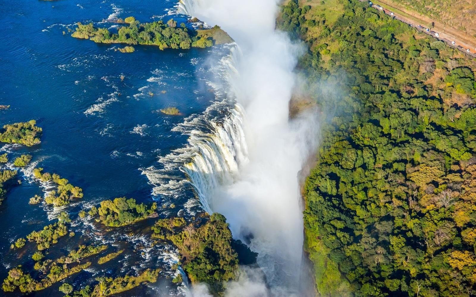 An aerial view of Victoria Falls on the Zambezi River, within Mosi-oa-Tunya National Park.