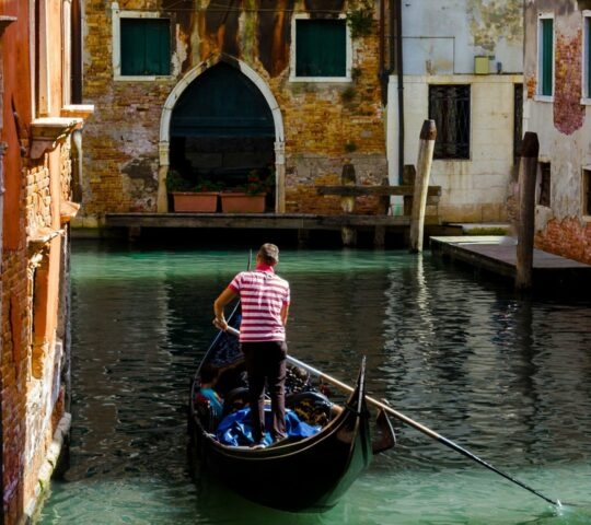 Gondola experience sunny day Venice Italy