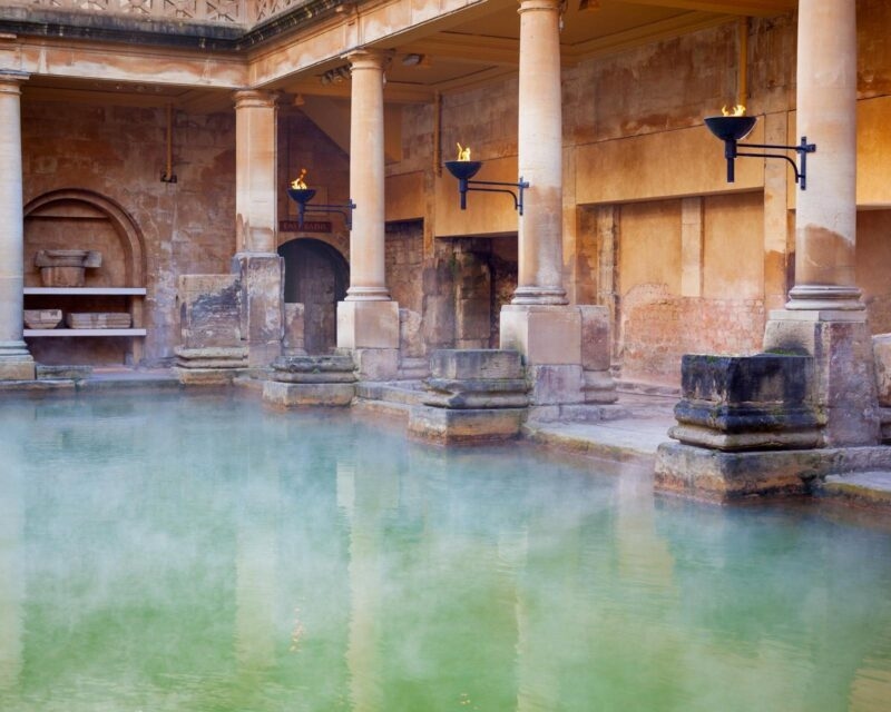 Steam rising from the main pool of the ancient Roman baths in Bath
