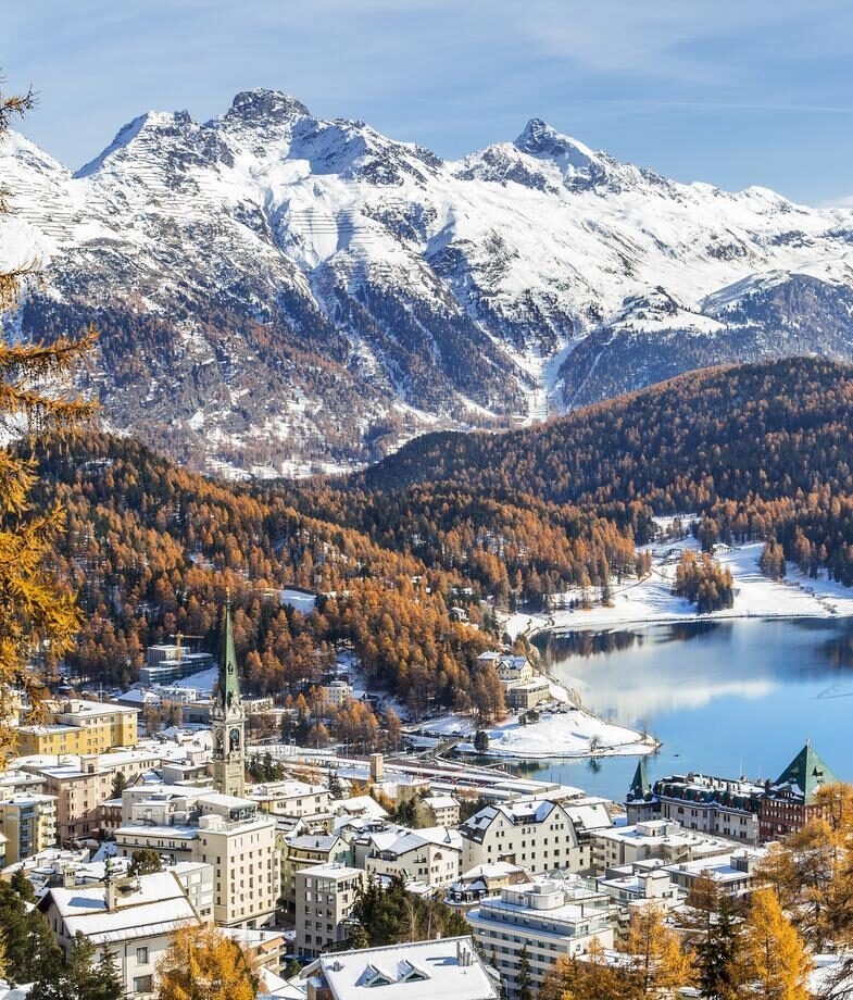 The snow-covered town of St. Moritz in Switzerland and the star-filled skies above the High Atlas Mountains in Morocco.