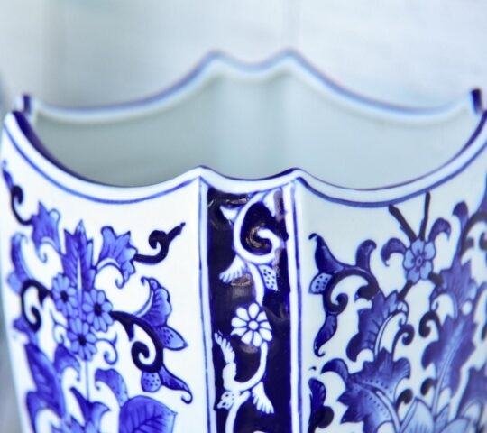 A close up of a blue and white porcelain vase.