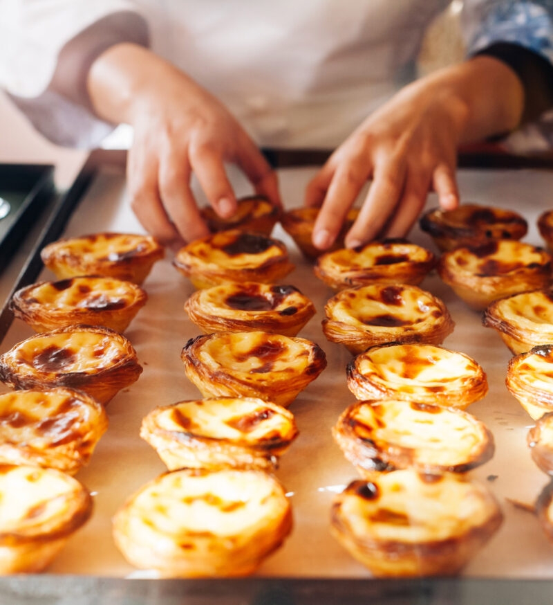 A tray of fresh pasteis de nata in Lisbon.