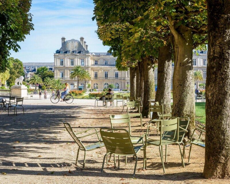 Metal chairs on a pathway in the Jardin du Luxembourg in Paris