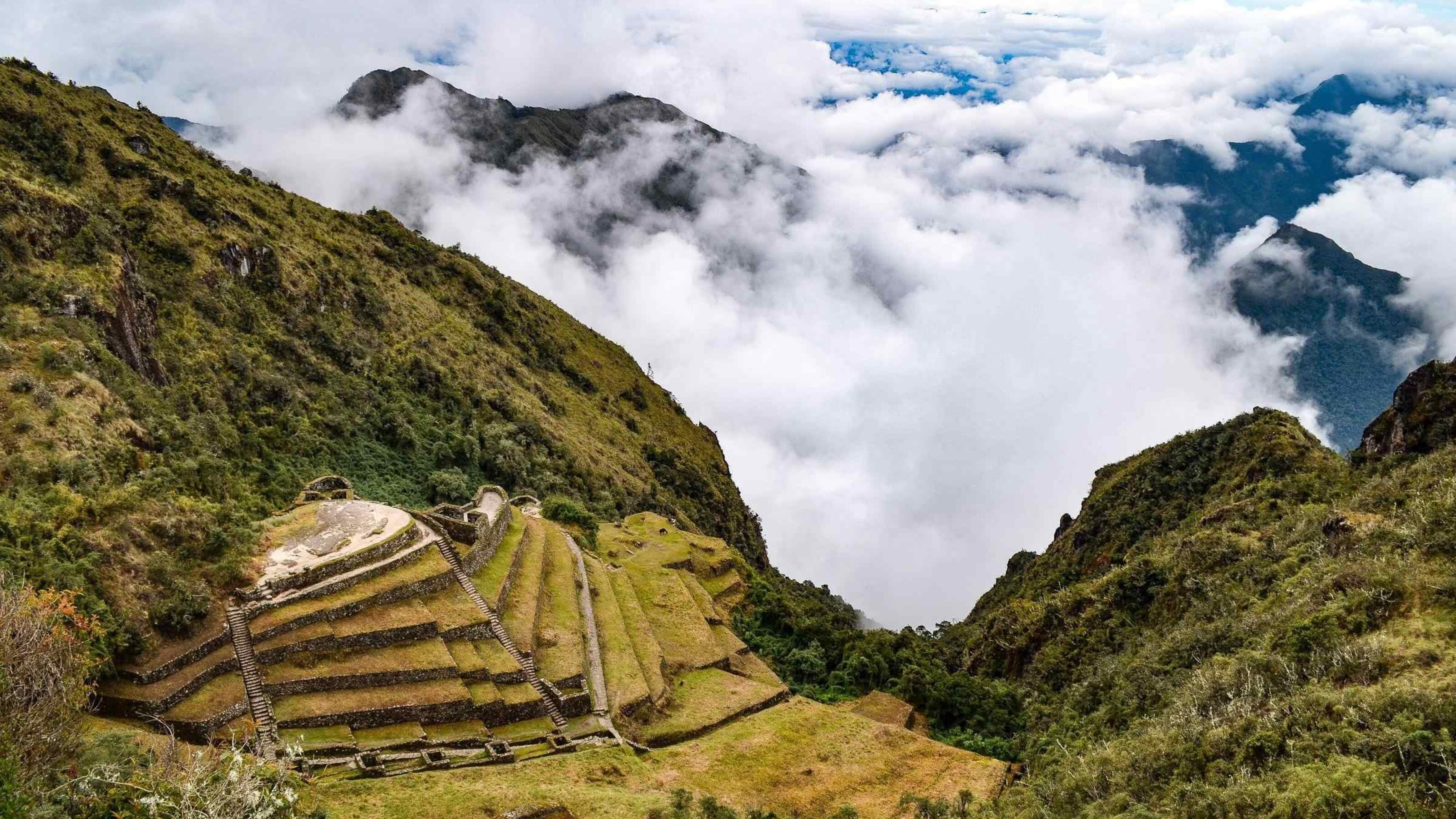 View of Incan ruins in Peru shrouded in mist