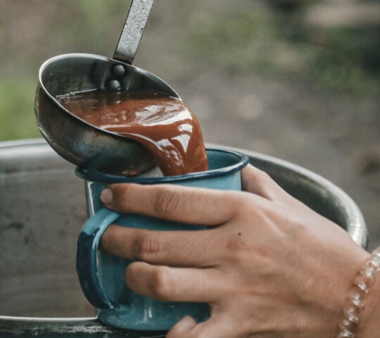 Serving cacao at a cacao ceremony with community