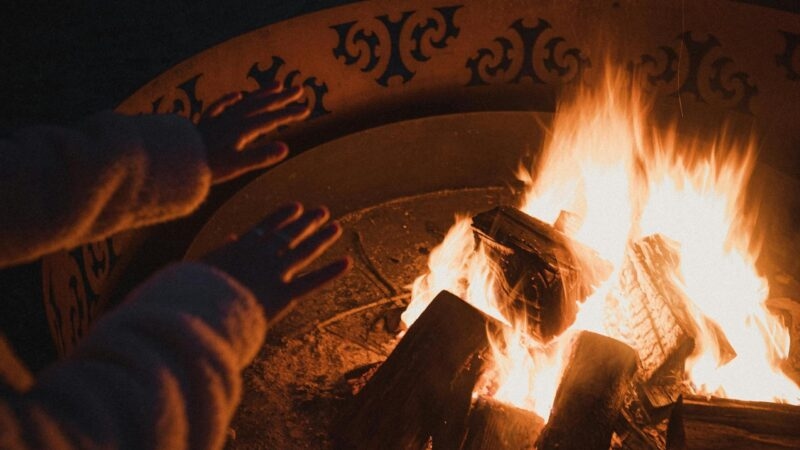 warming hands cosy fire New Zealand when stargazing