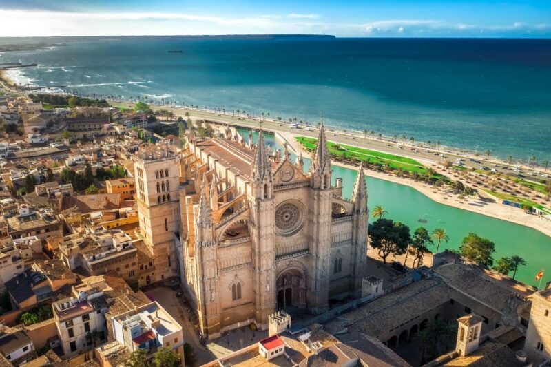 Aerial view of Palma de Mallorca cathedral next to the ocean