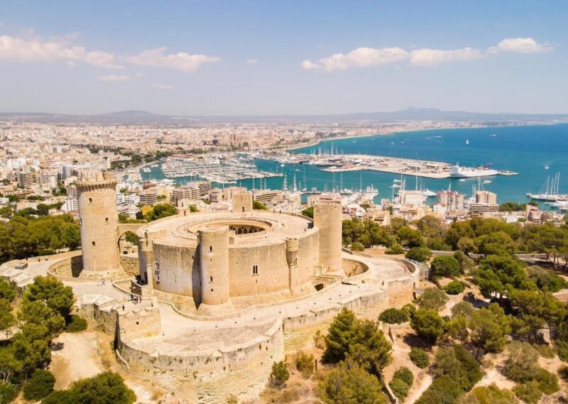 Aerial view of Bellver castle with Palma de Mallorca cityscape in the background
