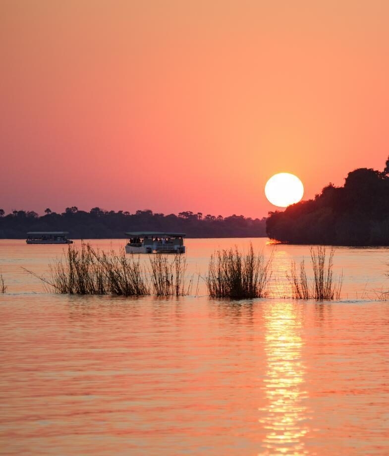 Enjoy a traditional Moroccan meal shared around the table, or drift along the Zambezi River on a sunset cruise as the light fades across the water.