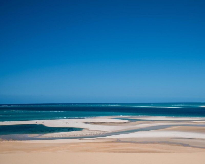 Aerial view of white sandbanks and turquoise ocean water at Bazaruto Archipelago in Mozambique.