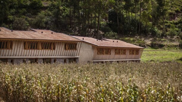 External view of Valle Sagrado Hotel set among crops ready for harvest, Sacred Valley, Peru