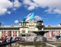 The fountain of Constitution Plaza lined with locals on a sunny day, Guatemala City in Guatemala