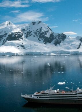 Antarctica iceberg with cruise ship