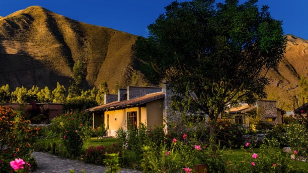Lush gardens of Sol y Luna Lodge and Spa at golden hour, Sacred Valley, Peru