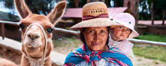 Bolivian woman carrying her baby, Isla del Sol, Bolivia