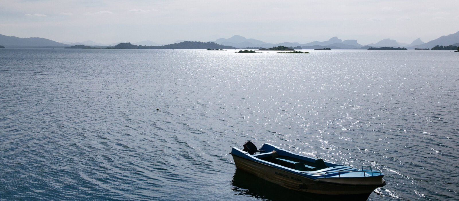 A small motorboat moored in the lake at Gal Oya National Park