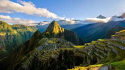 Panoramic view of Machu Picchu, Peru, drenched in sun beams