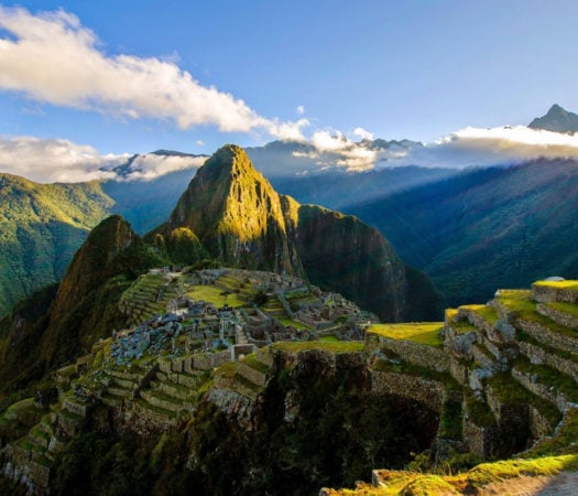 Panoramic view of Machu Picchu, Peru, drenched in sun beams