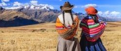 Two Quechua women looking out across the plains of the Sacred Valley, Peru