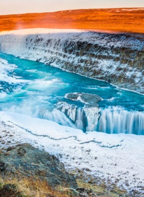 Amazing Icelandic winter landscape of majestic waterfall of frozen Gullfoss