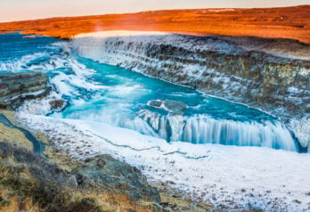 Amazing Icelandic winter landscape of majestic waterfall of frozen Gullfoss