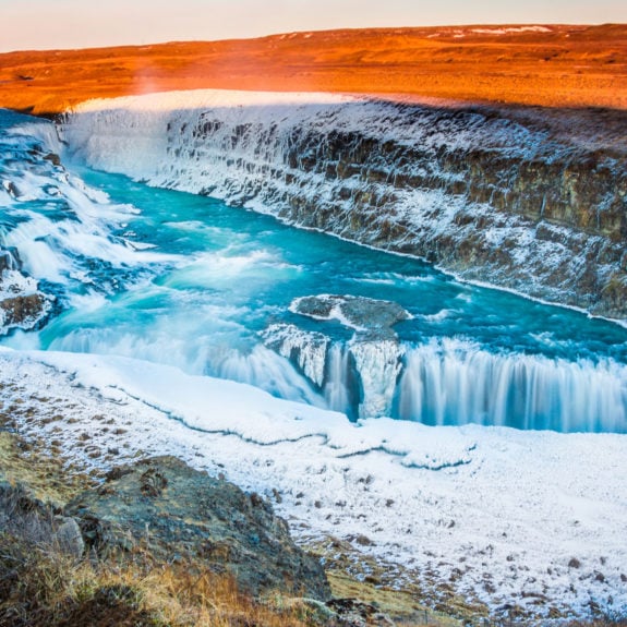 Amazing Icelandic winter landscape of majestic waterfall of frozen Gullfoss