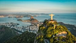 Panoramic of Christ the Redeemer, Rio de Janeiro, at golden hour set against the city and Guanabara Bay