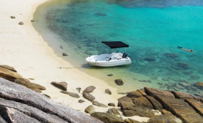 A small boat on the white sand at Lizard Island, Australia