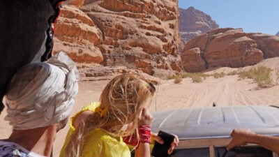 Jordan, The Wadi Rum Desert - tourist visiting the desert