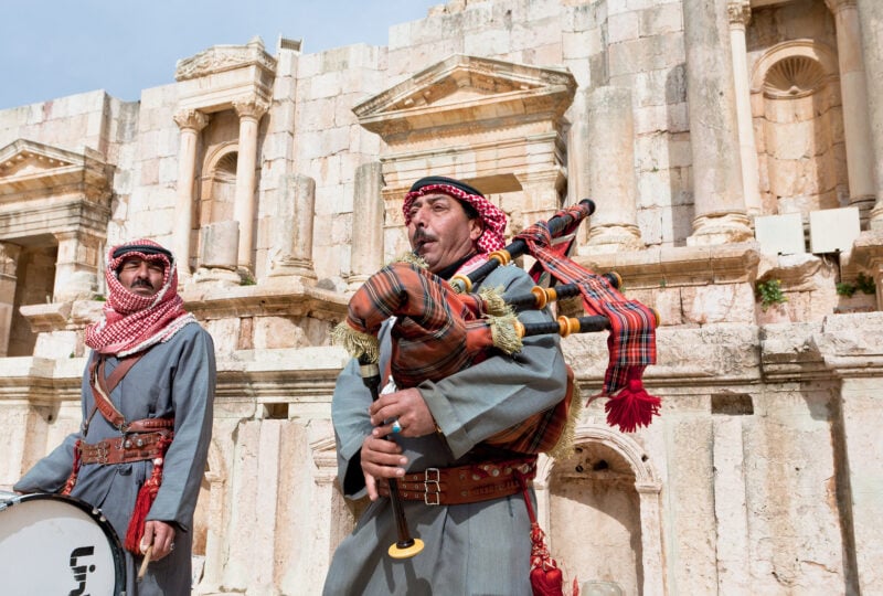 Bedouin plays on bagpipes in ancient town Gerasa (Jerash) in Jordan