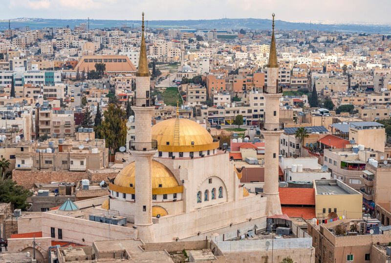 Madaba, Jordan, view of the central and largest mosque with high minarets in the ancient city of the Middle East.