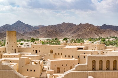 Looking out across Bahla Fort (Qal'at Bahla) against the backdrop of the Djebel Akhdar highlands in Oman