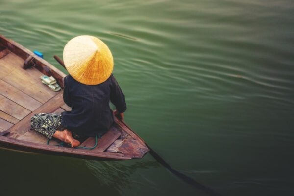 A woman rowing boat in Cai Rang Vietnam.