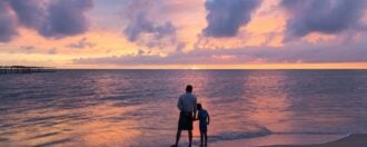 Father and son at Alleppey Alappuzha Beach Kerala India