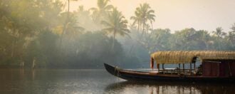 A traditional house boat in Kerala's Backwaters, India.