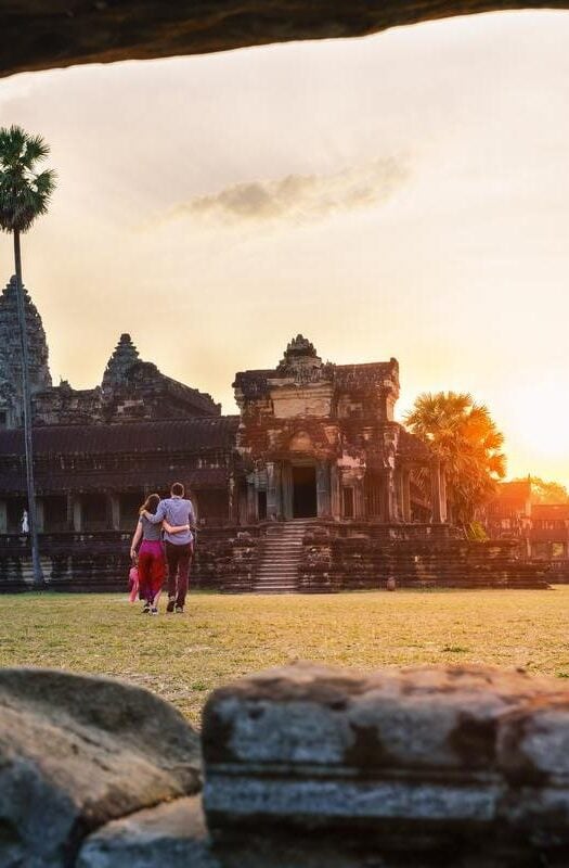 A couple in Angkor Wat at sunrise moment, Siem Reap, Cambodia