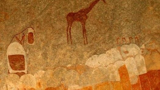 Ancient rock painting of human figures and antelopes, giraffe in Zimbabwe