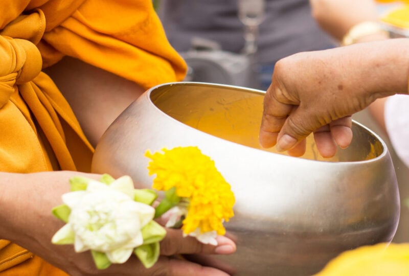 Giving alms to monks in Luang Prabang, Laos