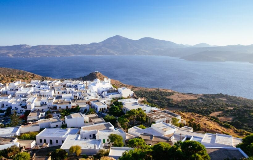 Scenic view of ocean and traditional Greek village Plaka on Milos island, Greece